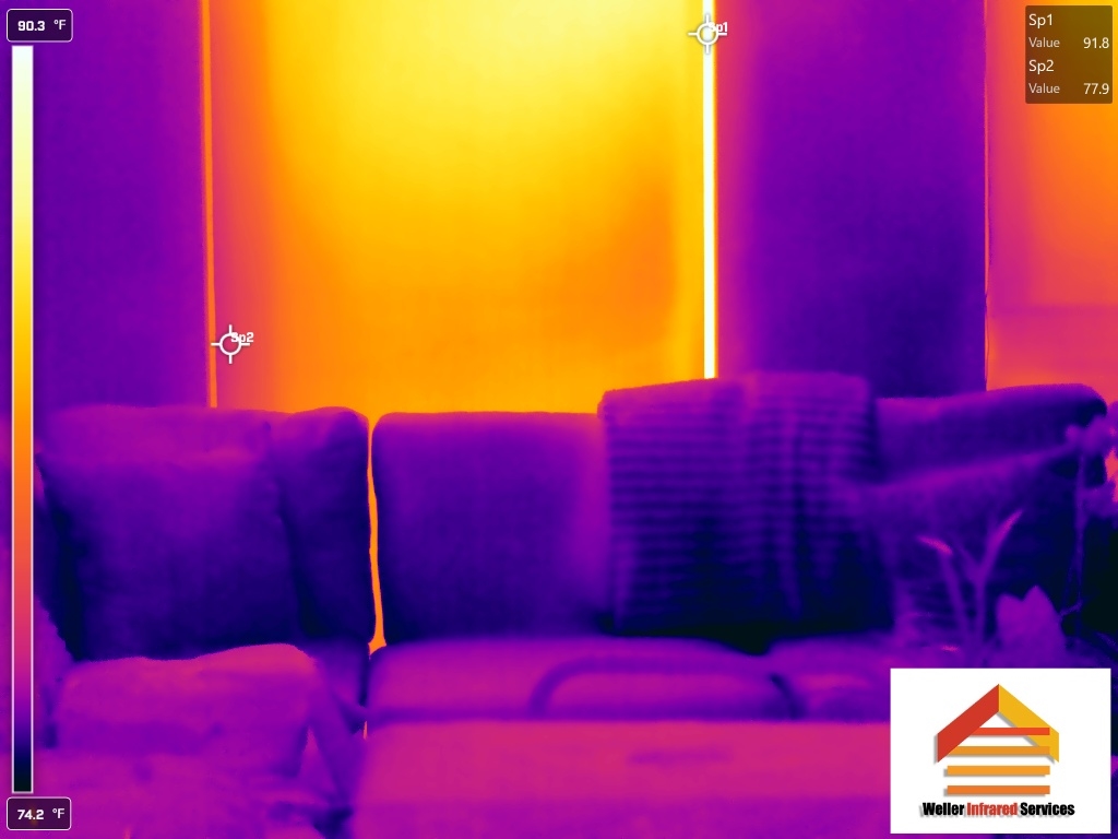 Infrared scan showing heat gain through window behind furniture