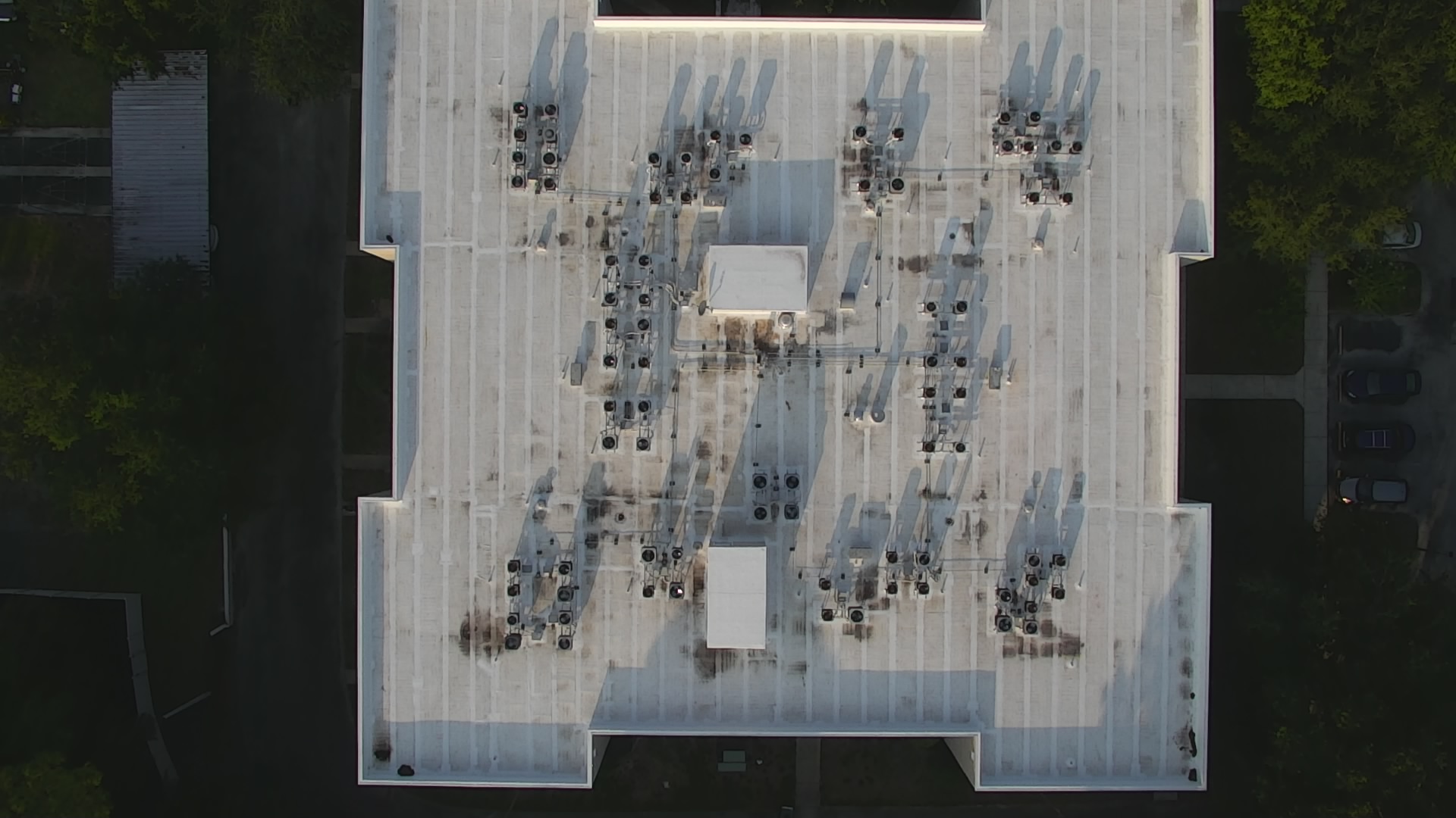 Aerial drone photograph of commercial flat roof with HVAC condensers