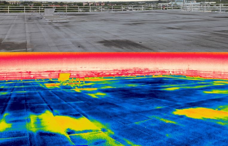 Side-by-side regular and infrared views of a flat roof showing thermal color differences