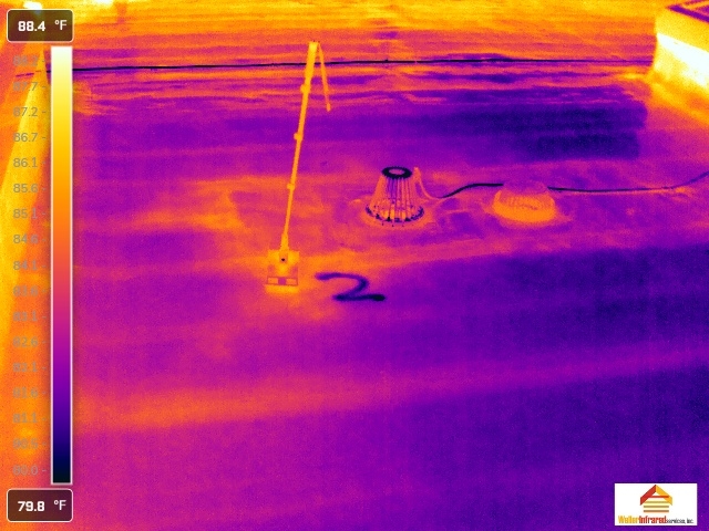 Infrared roof scan showing moisture patterns around flat roof drain